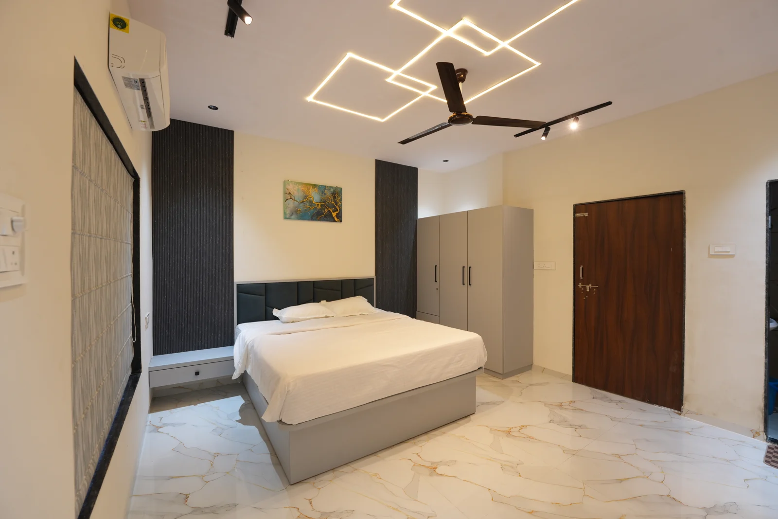 Bedroom one with double bed and air conditioning