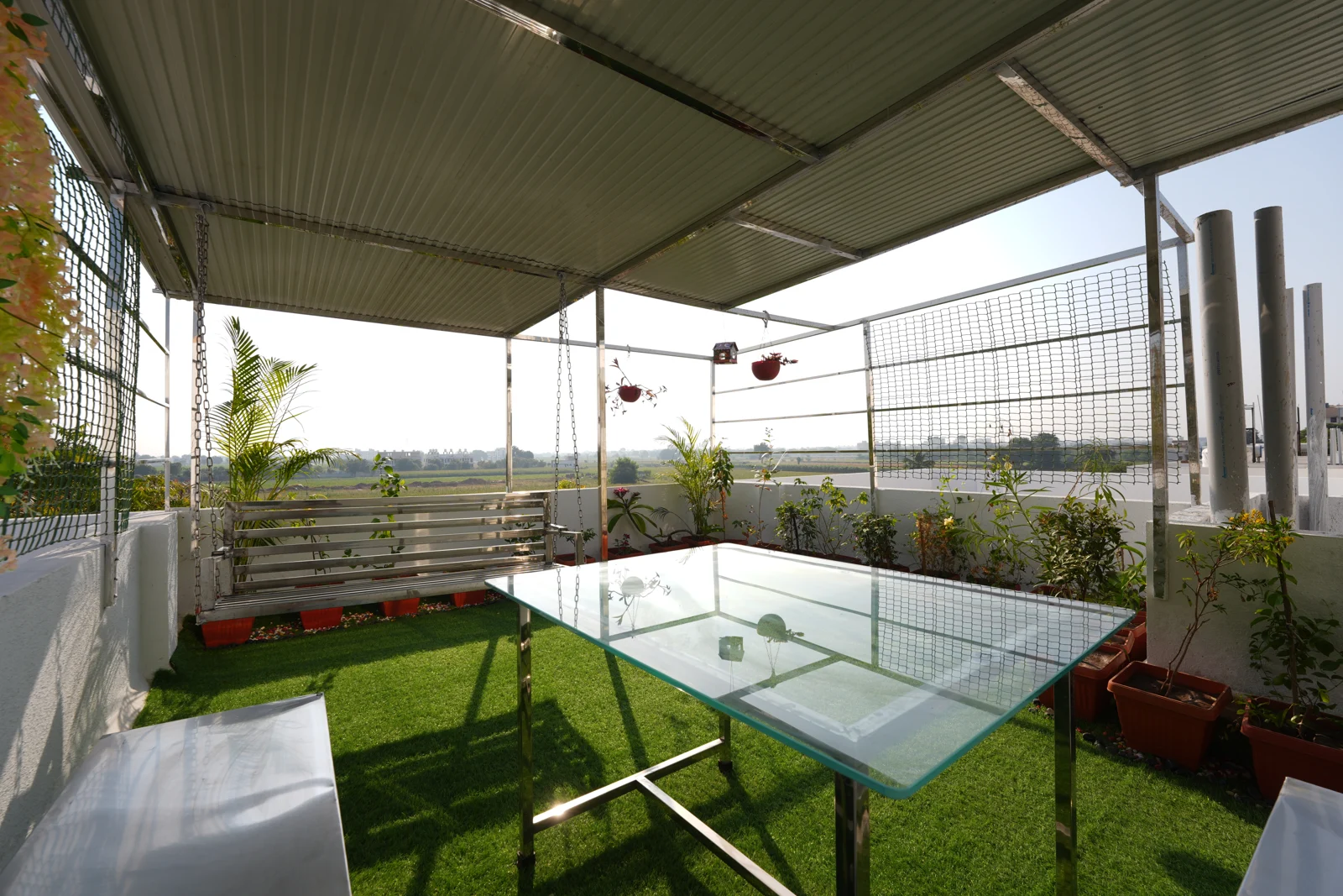 Covered terrace seating area at SAI MITRA VILLA
